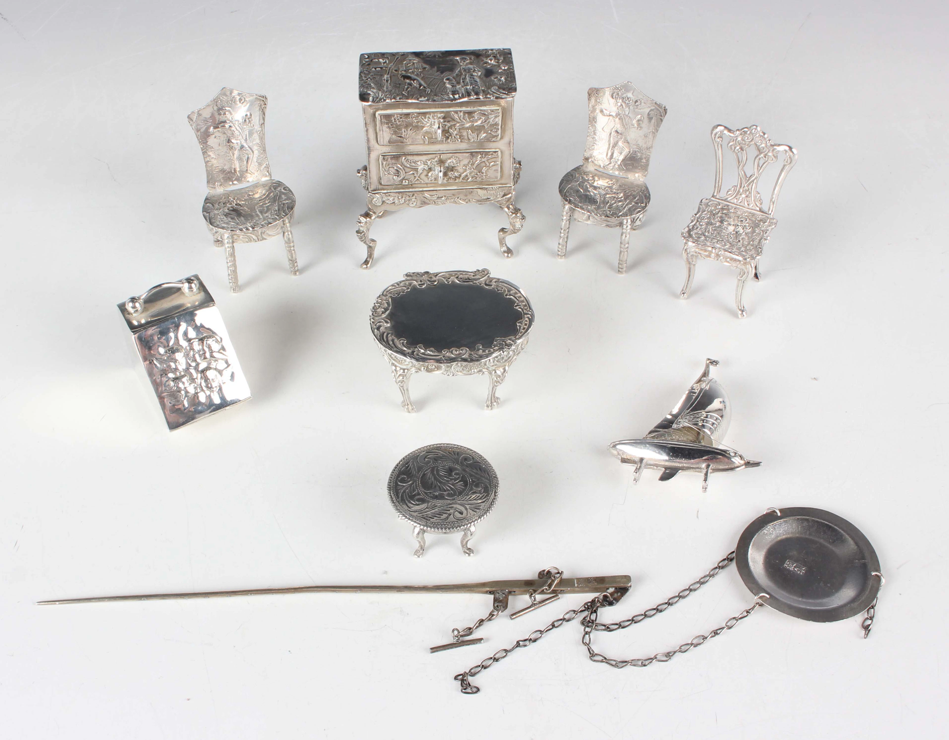 An Edwardian silver miniature toy two-drawer chest, decorated with