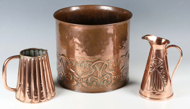 An Arts and Crafts copper cylindrical planter, probably Newlyn, worked