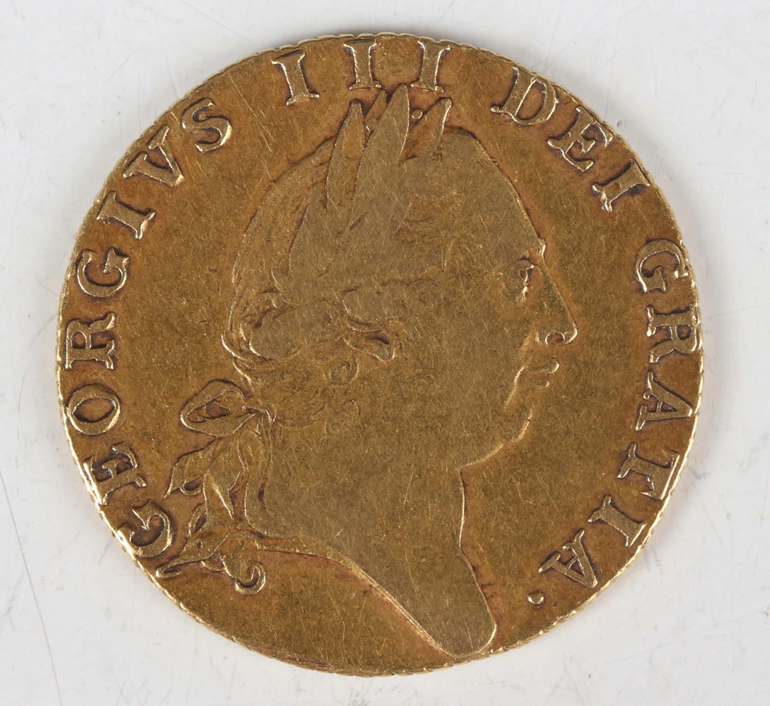 A George III spade guinea 1788, fifth laureate head, Sp 3729 (good/fine).