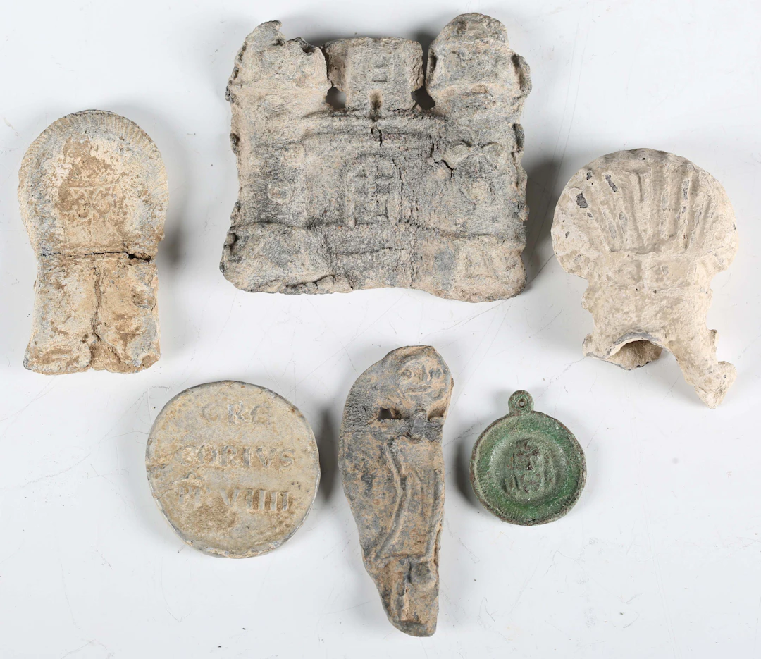 A group of medieval pilgrims' artefacts, comprising a papal bulla