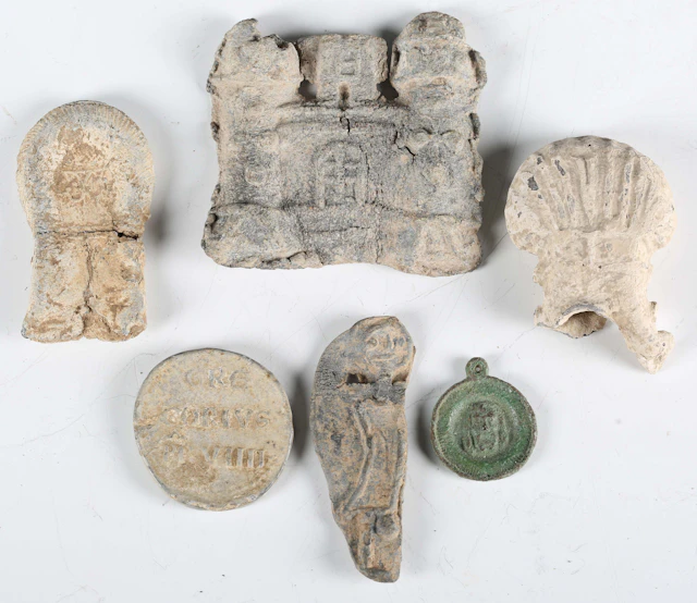 A group of medieval pilgrims' artefacts, comprising a papal bulla