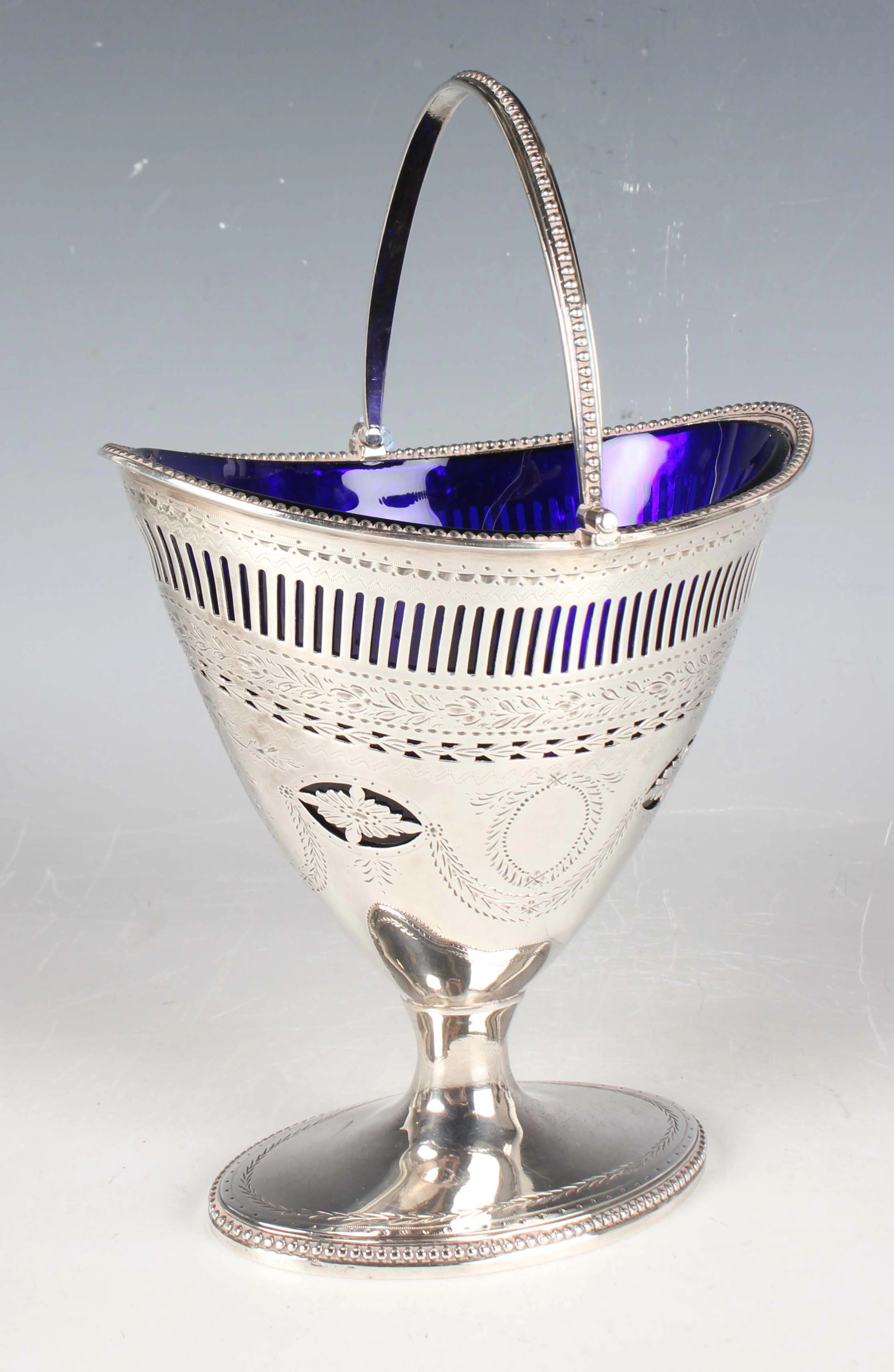A George III silver sugar basket of oval tapering form with beaded