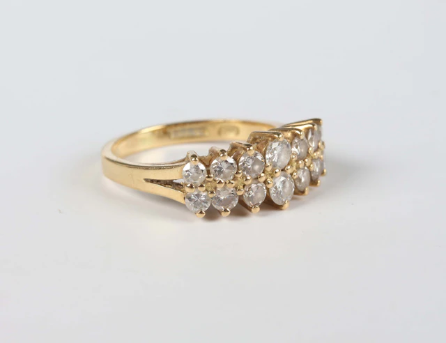 An 18ct gold and diamond ring, mounted with two rows of graduated