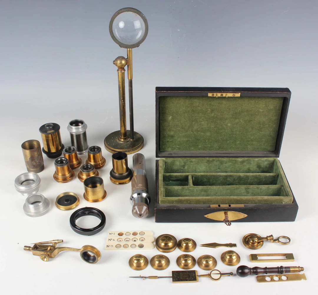 A 19th century brass adjustable bullseye condenser on a cylindrical