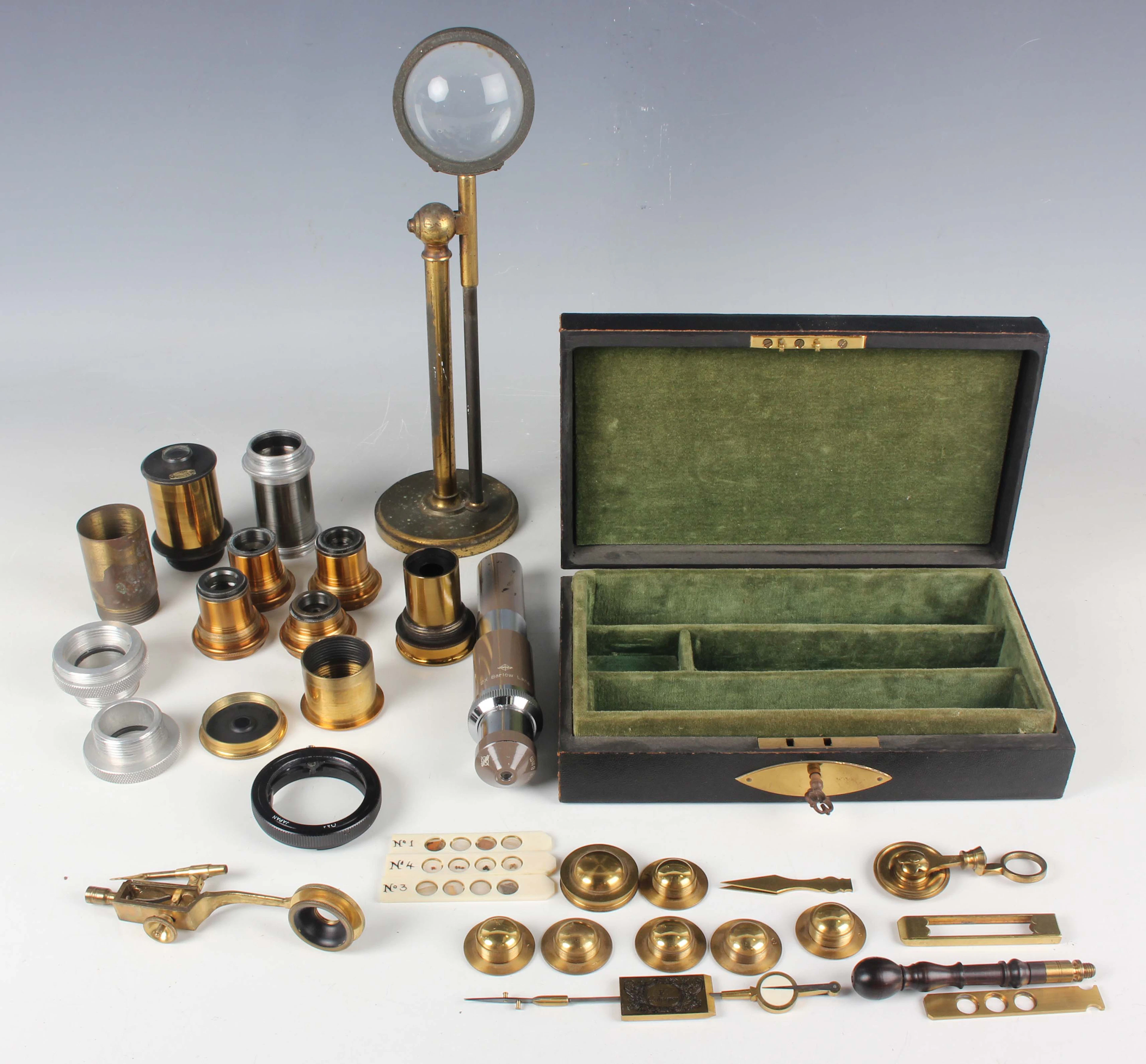 A 19th century brass adjustable bullseye condenser on a cylindrical