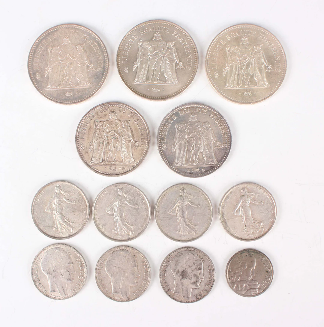 A small collection of French silver and other coinage, including three