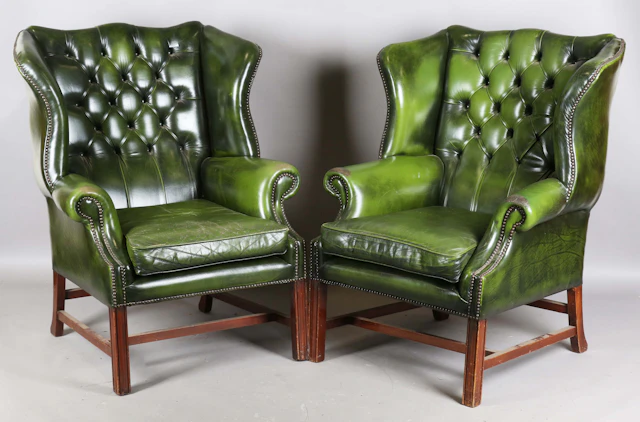 A pair of late 20th century George III style buttoned green leather
