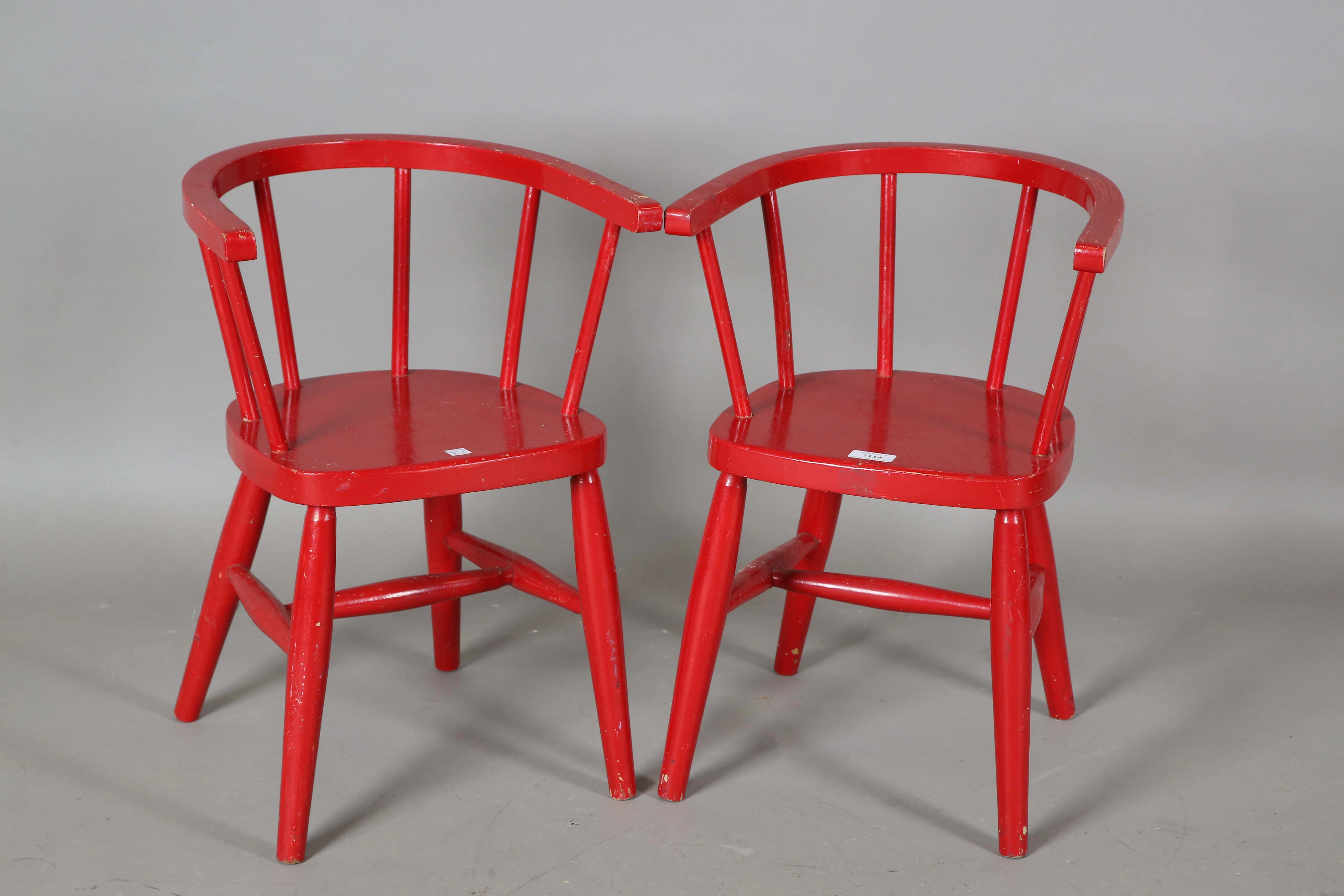 A pair of 20th century red painted tub back Windsor children's chairs