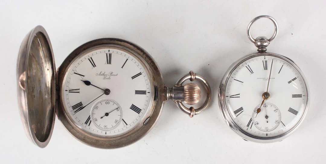 A Swiss silver hunting cased keyless wind gentleman's pocket watch