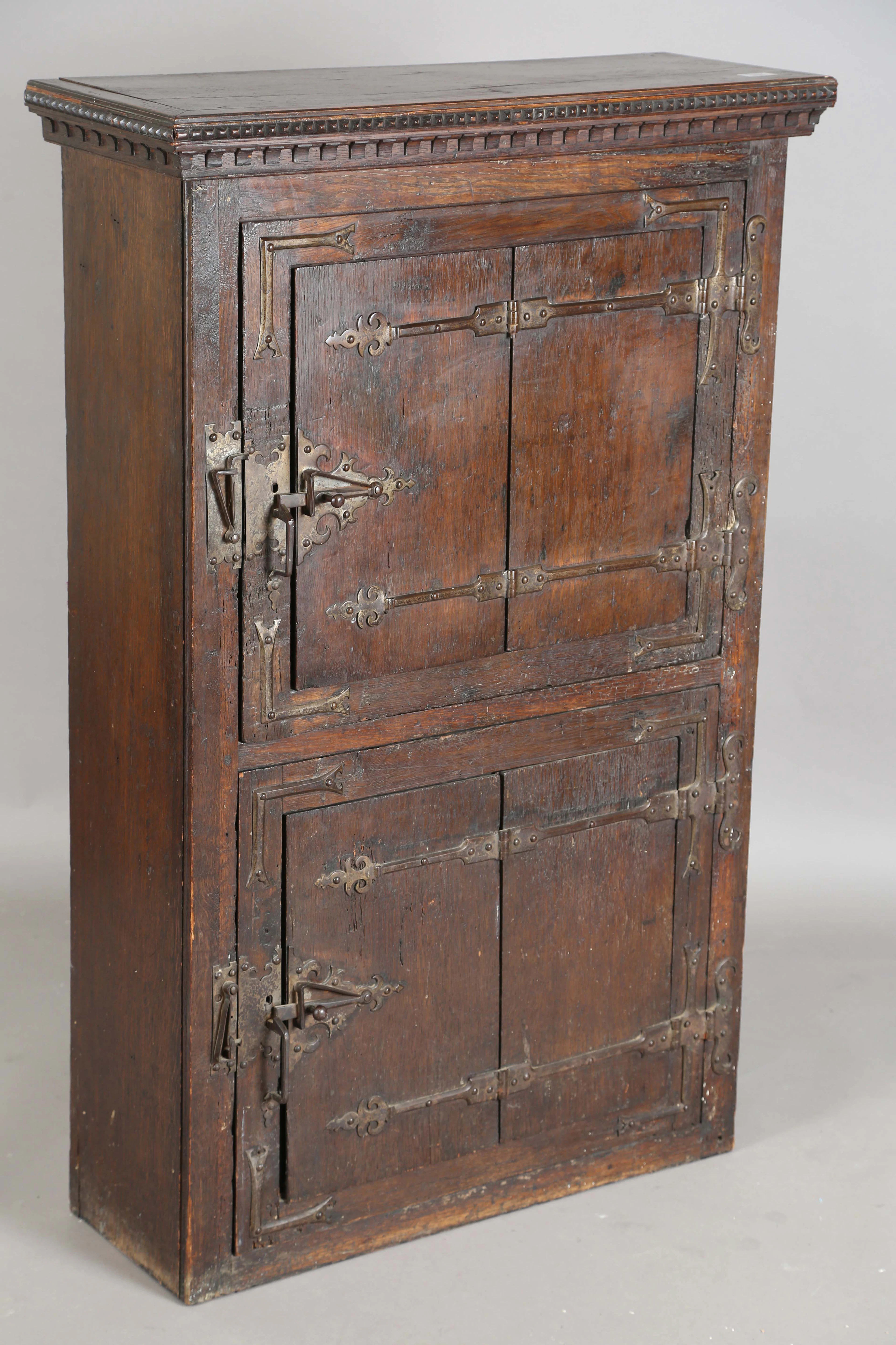 A late 19th/early 20th century Medieval Revival oak side cabinet