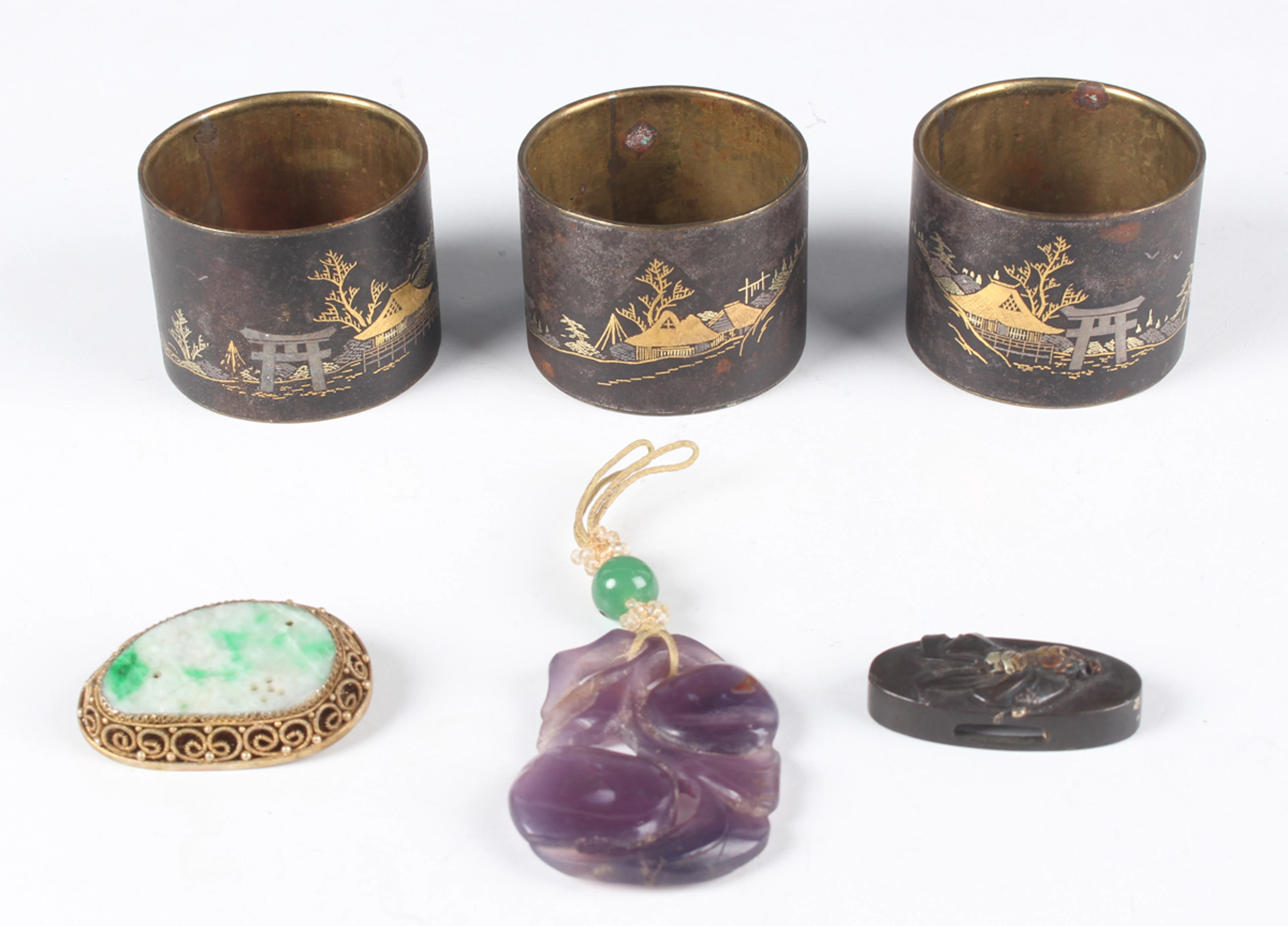 A Chinese amethyst quartz pendant, 20th century, carved and pierced