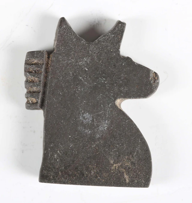 An ancient Egyptian greywacke Eye of Horus amulet, length 2.5cm.