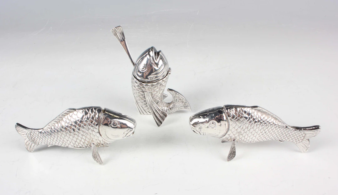An Elizabeth II silver novelty three-piece condiment set, each in