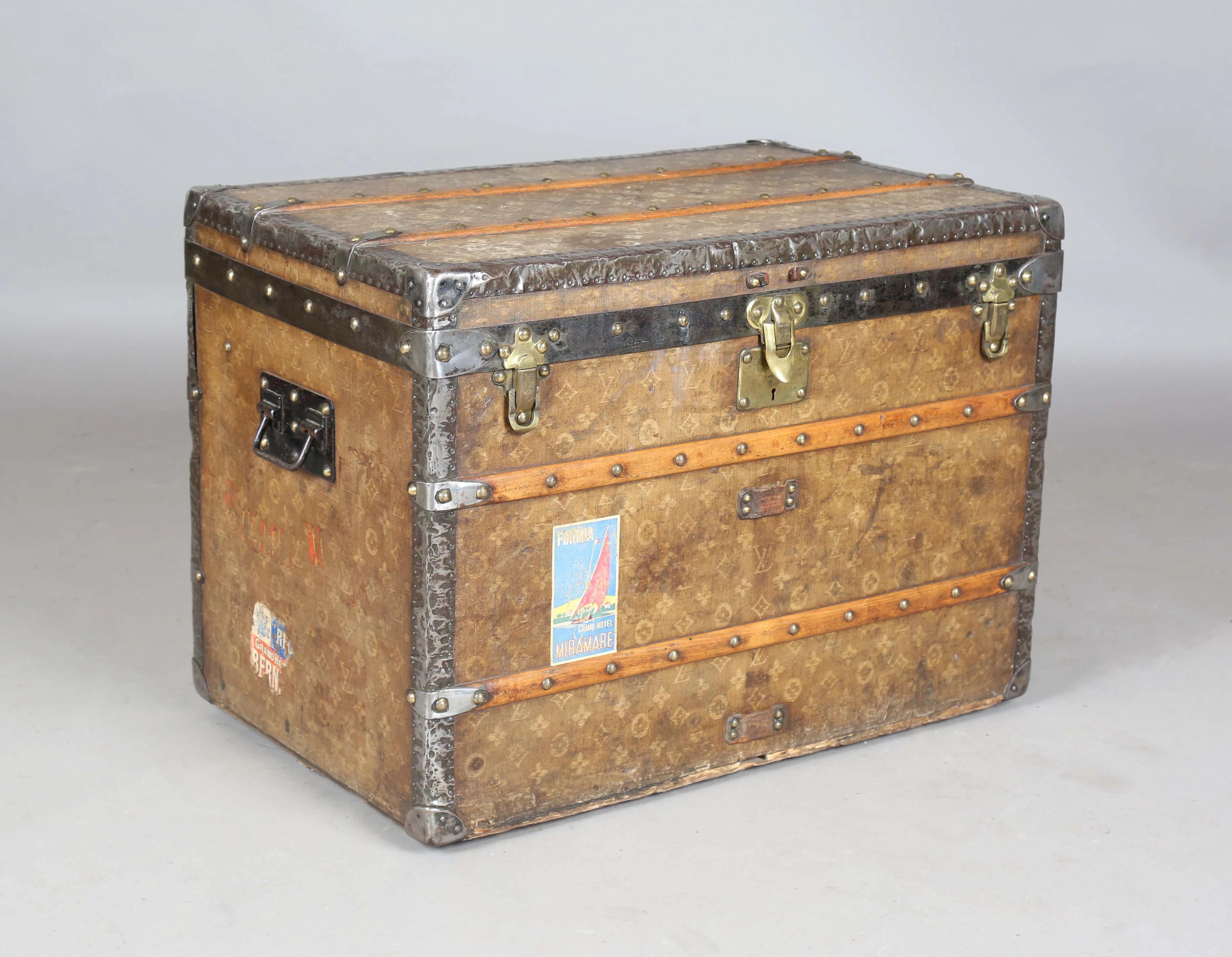 An early 20th century Louis Vuitton trunk, covered in an overall monogram