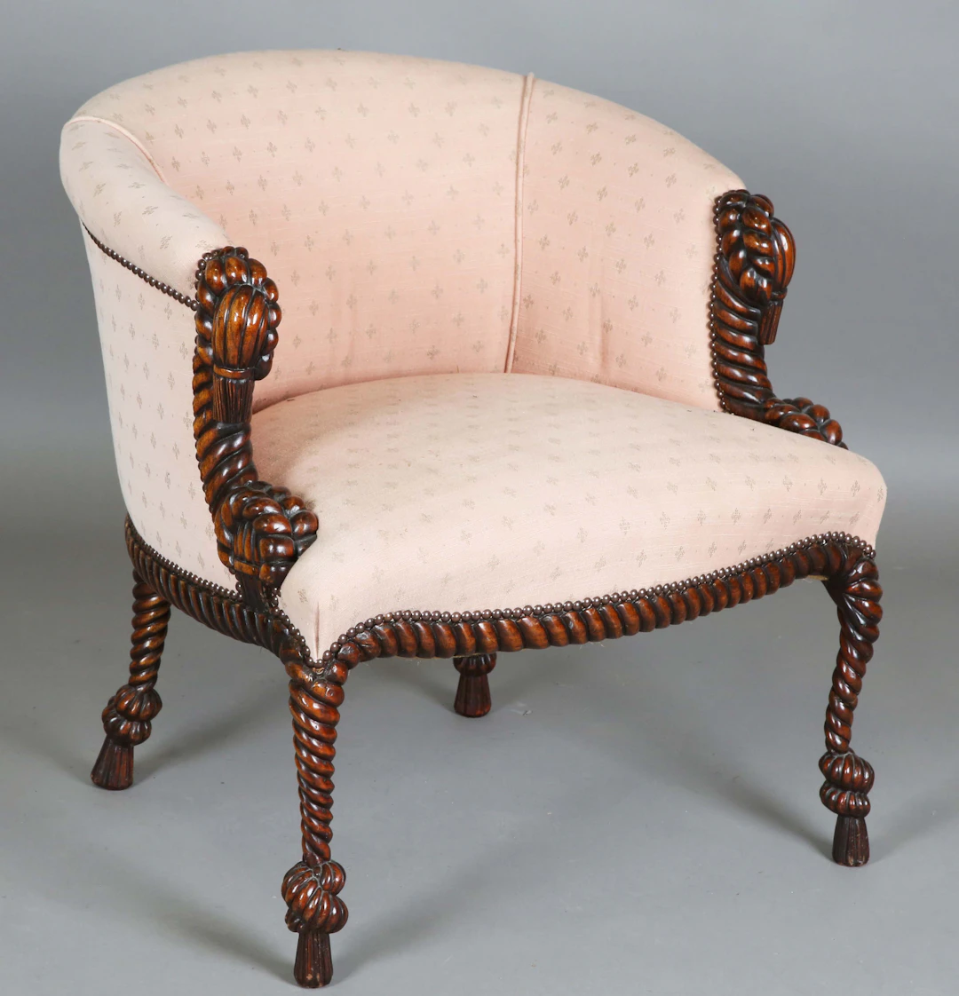 A late 20th century French reproduction hardwood framed tub back armchair