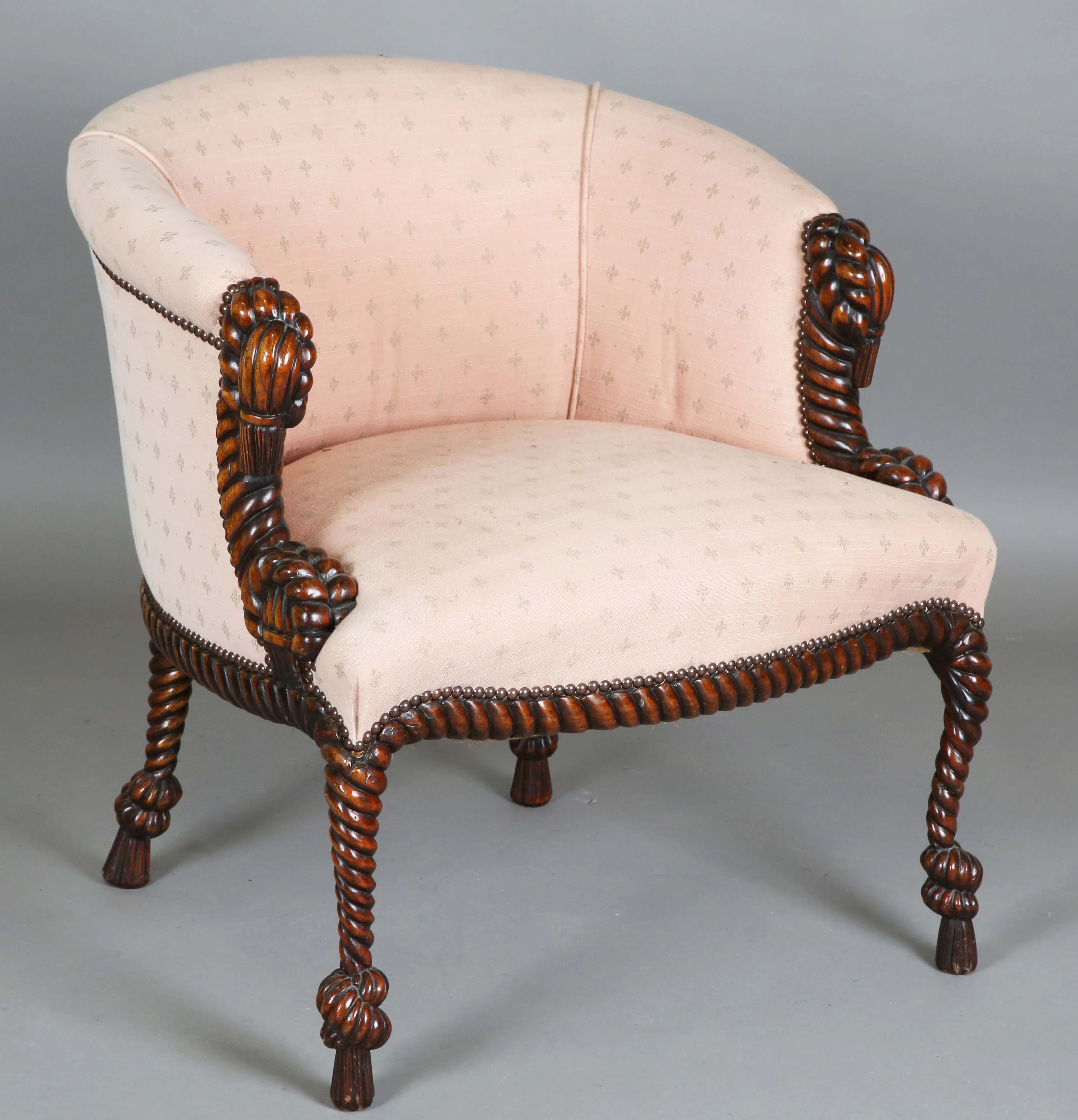 A late 20th century French reproduction hardwood framed tub back armchair