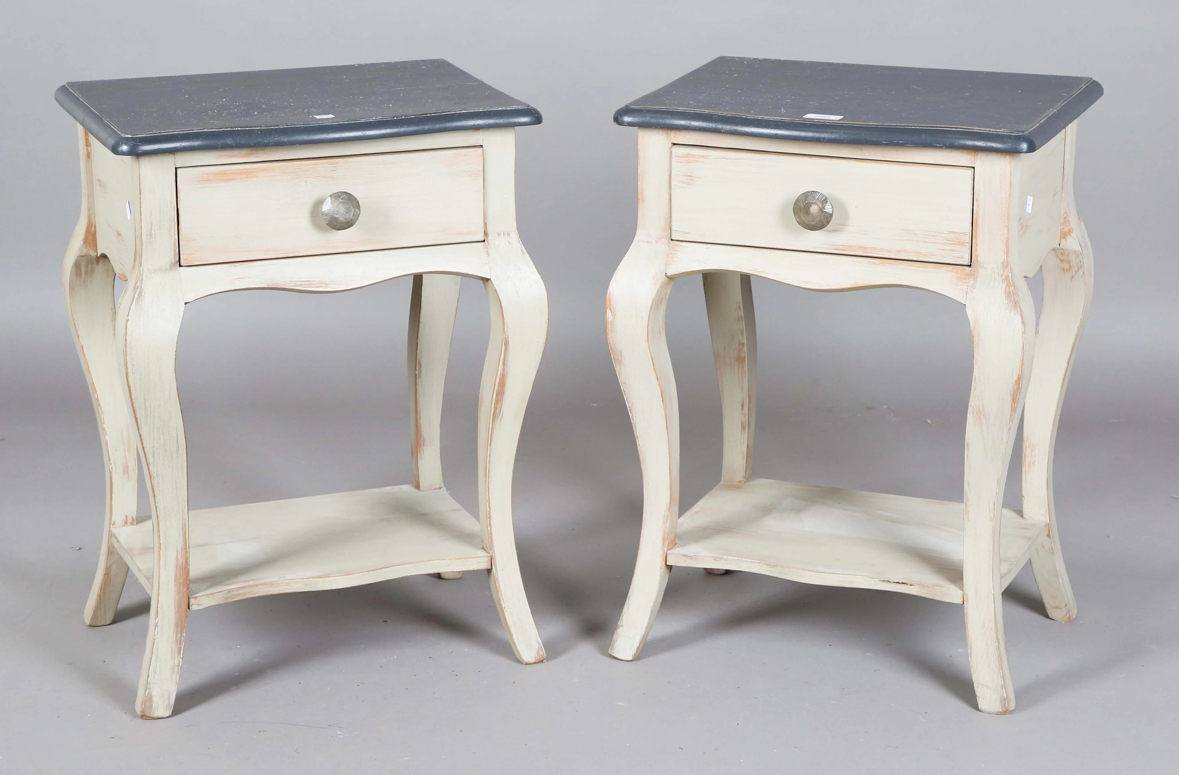 A pair of modern grey and black painted bedside tables, each fitted
