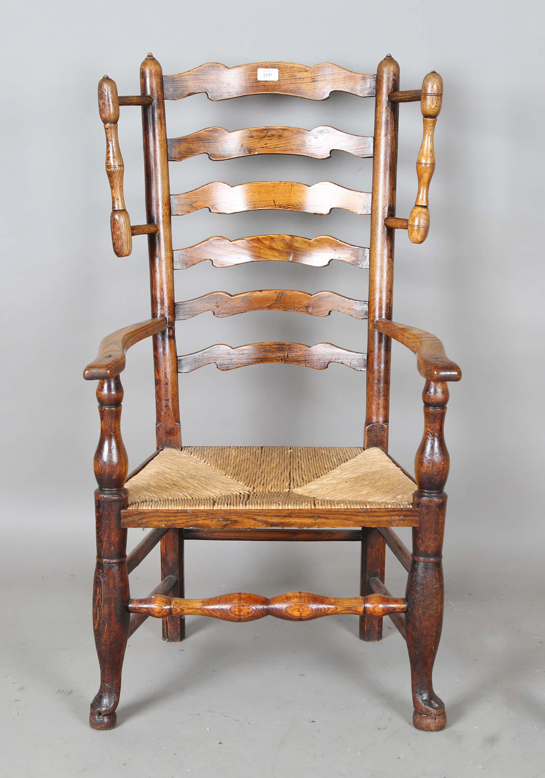 An early 19th century provisional ash framed ladder back armchair