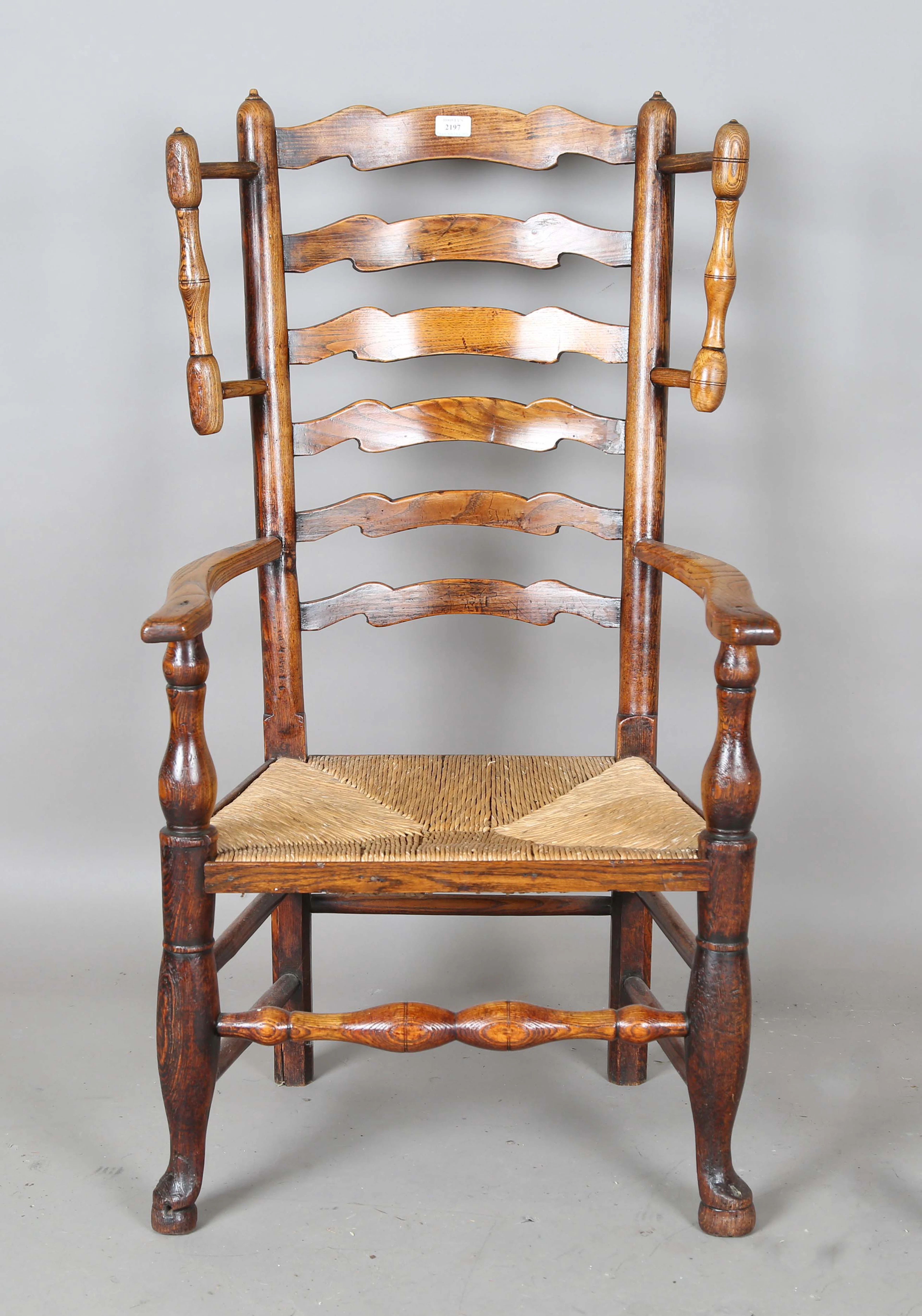 An early 19th century provisional ash framed ladder back armchair