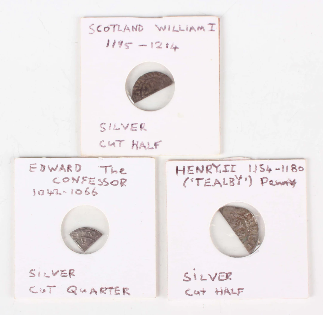 A group of three hammered silver fraction-cut coins, comprising an
