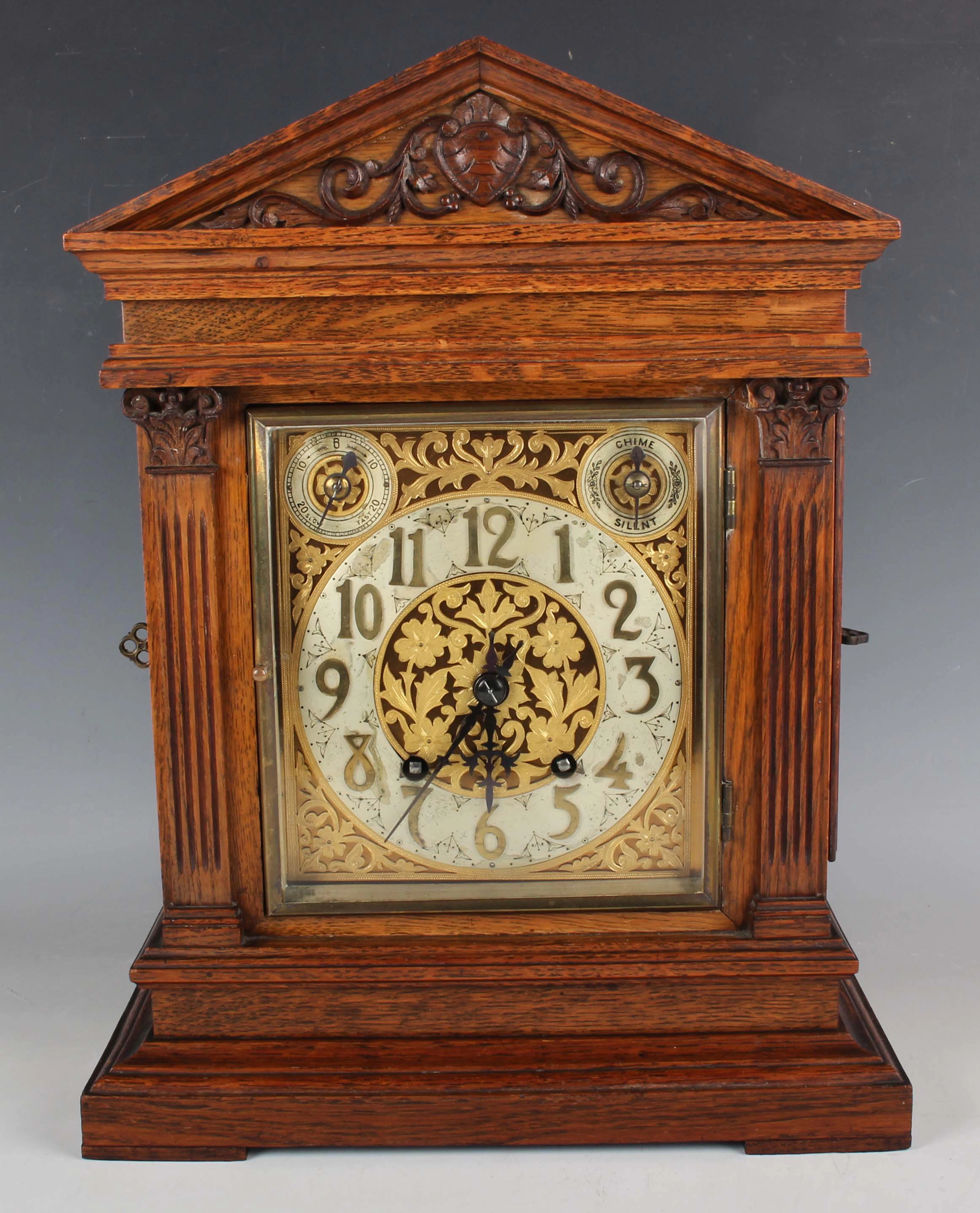 A late 19th century oak cased mantel clock with eight day movement