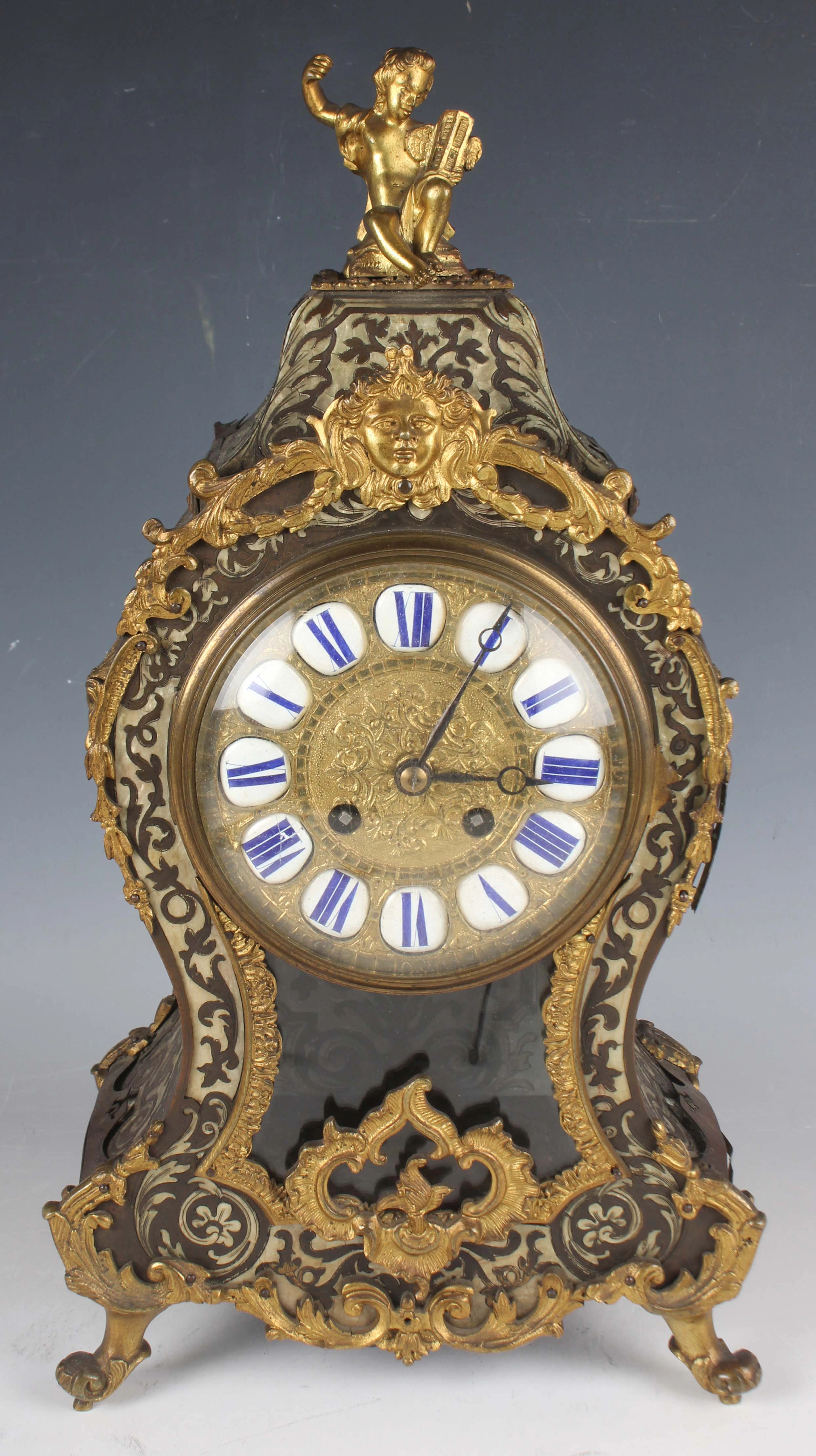 A late 19th century French brass boulle cased mantel clock with eight