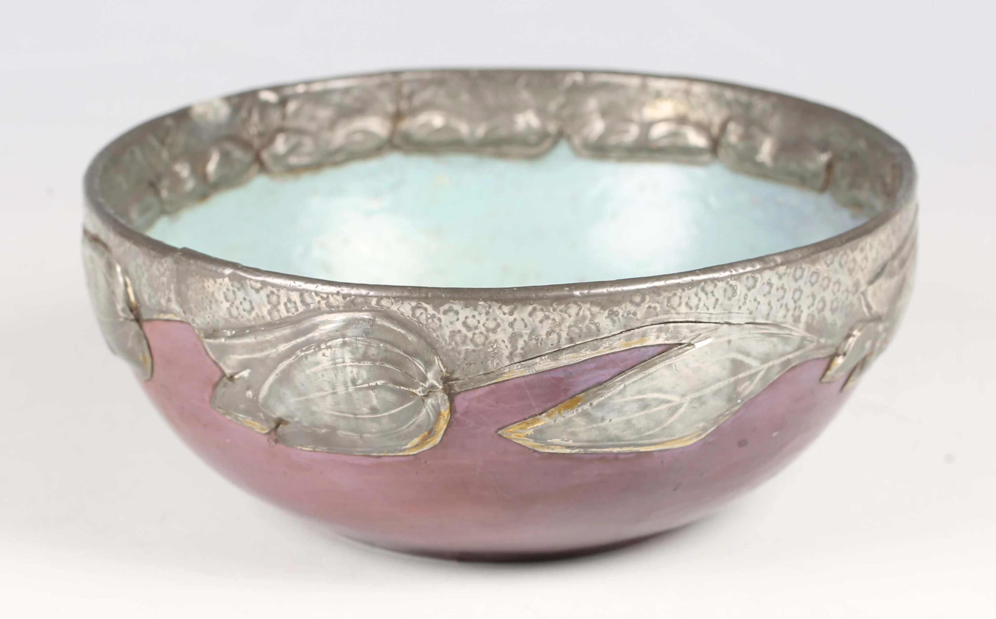 An Art Nouveau painted papier-mâché and pewter mounted bowl, the purple