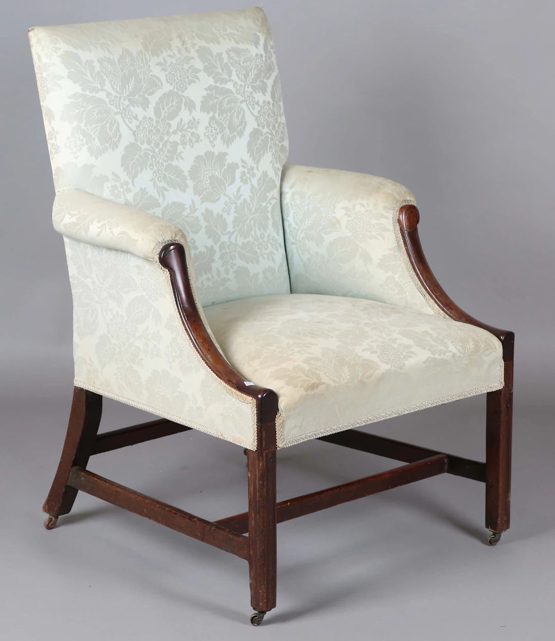 A George III mahogany framed Gainsborough armchair, upholstered in
