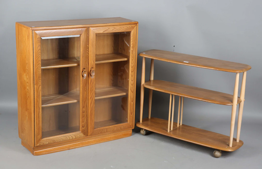 An Ercol elm three-tier book trolley, height 71cm, width 91cm, depth
