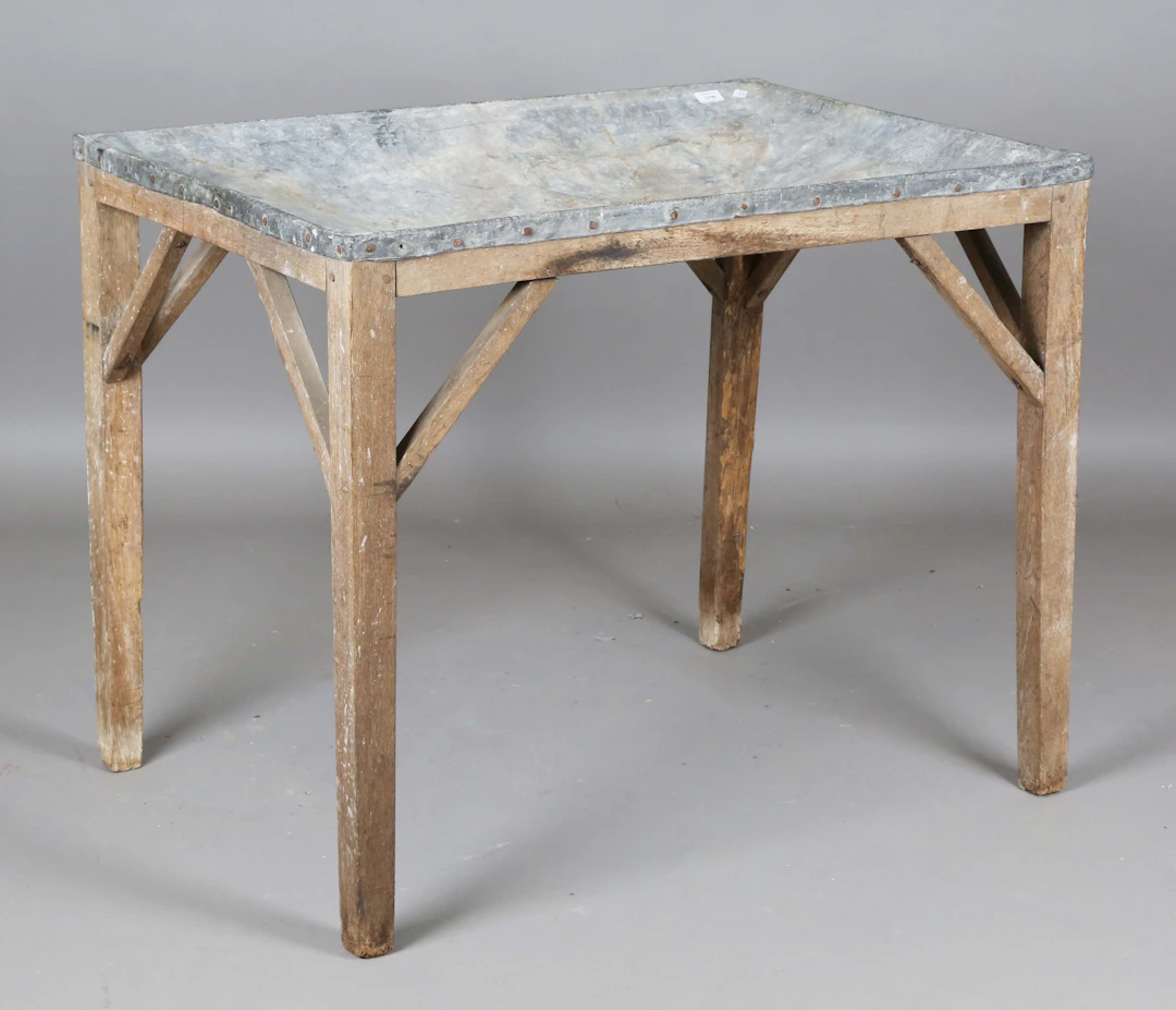 A late Victorian oak framed potting or dairy table, the lead-covered