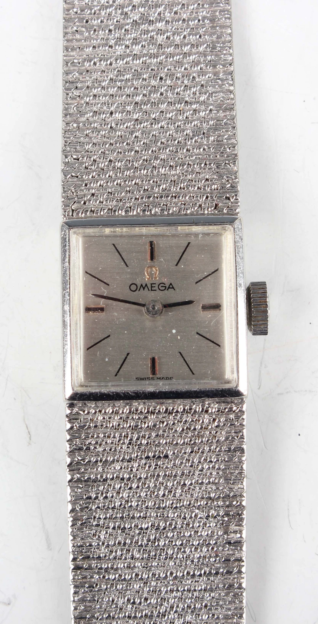 An Omega 9ct white gold lady's bracelet wristwatch with signed and