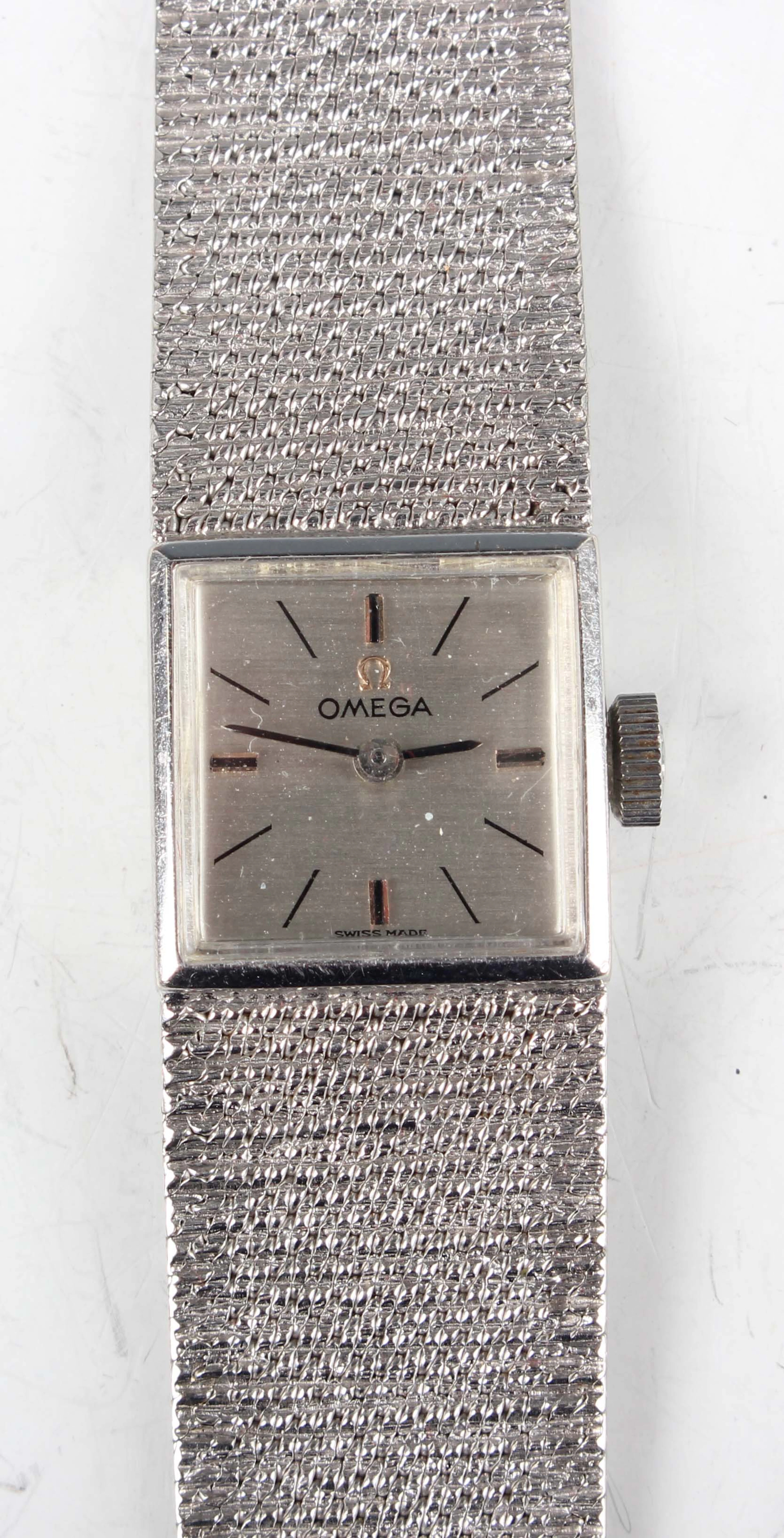 An Omega 9ct white gold lady's bracelet wristwatch with signed and