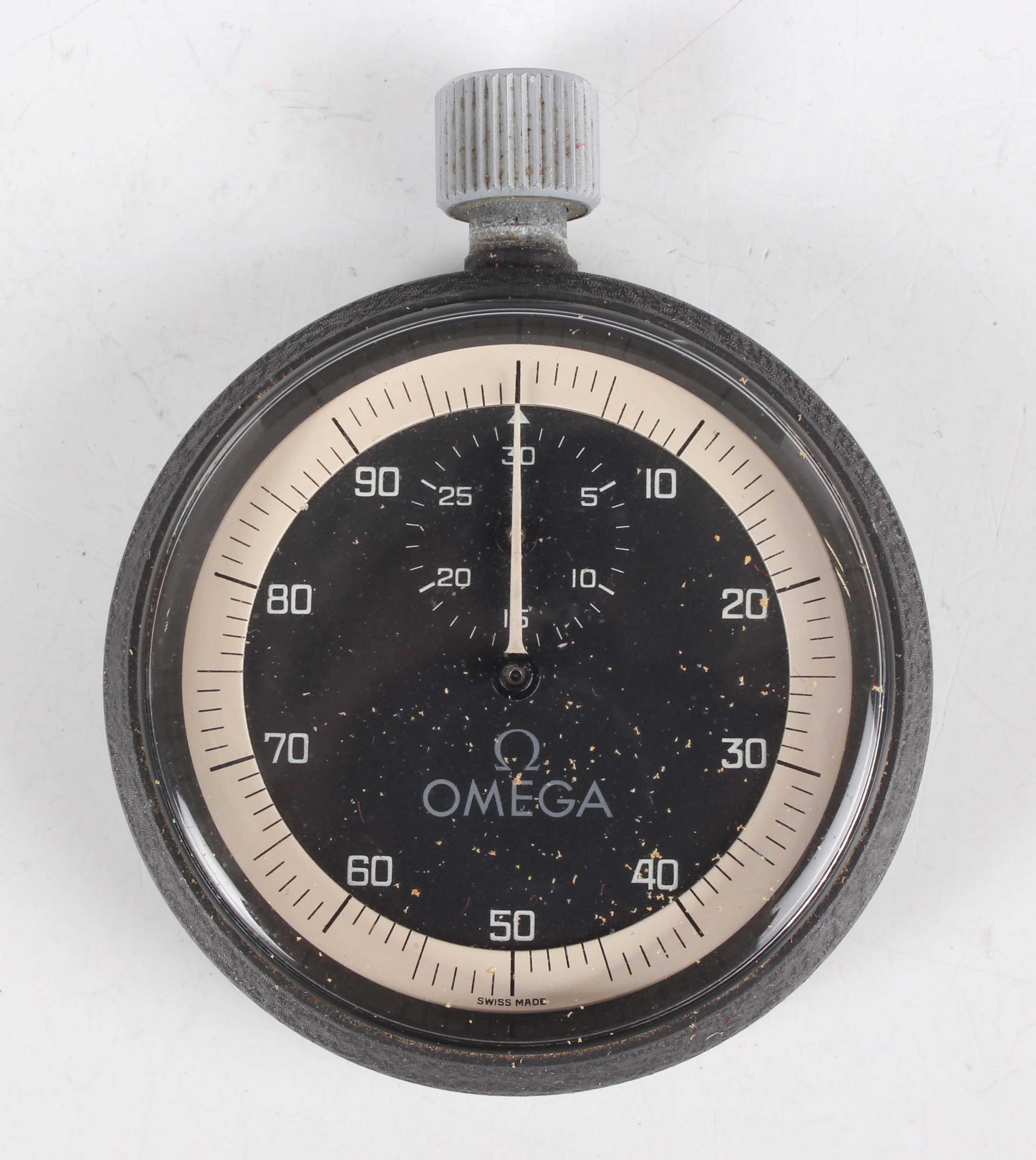 An Omega steel cased thirty minute Olympic style stopwatch, the signed