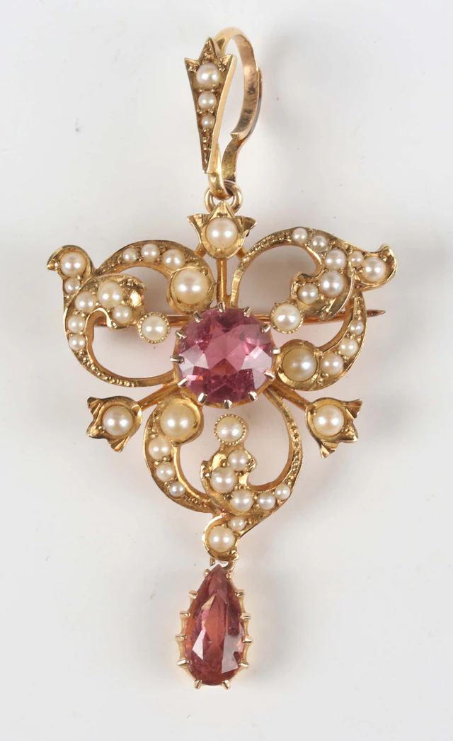 A gold, pink tourmaline and seed pearl brooch pendant of openwork