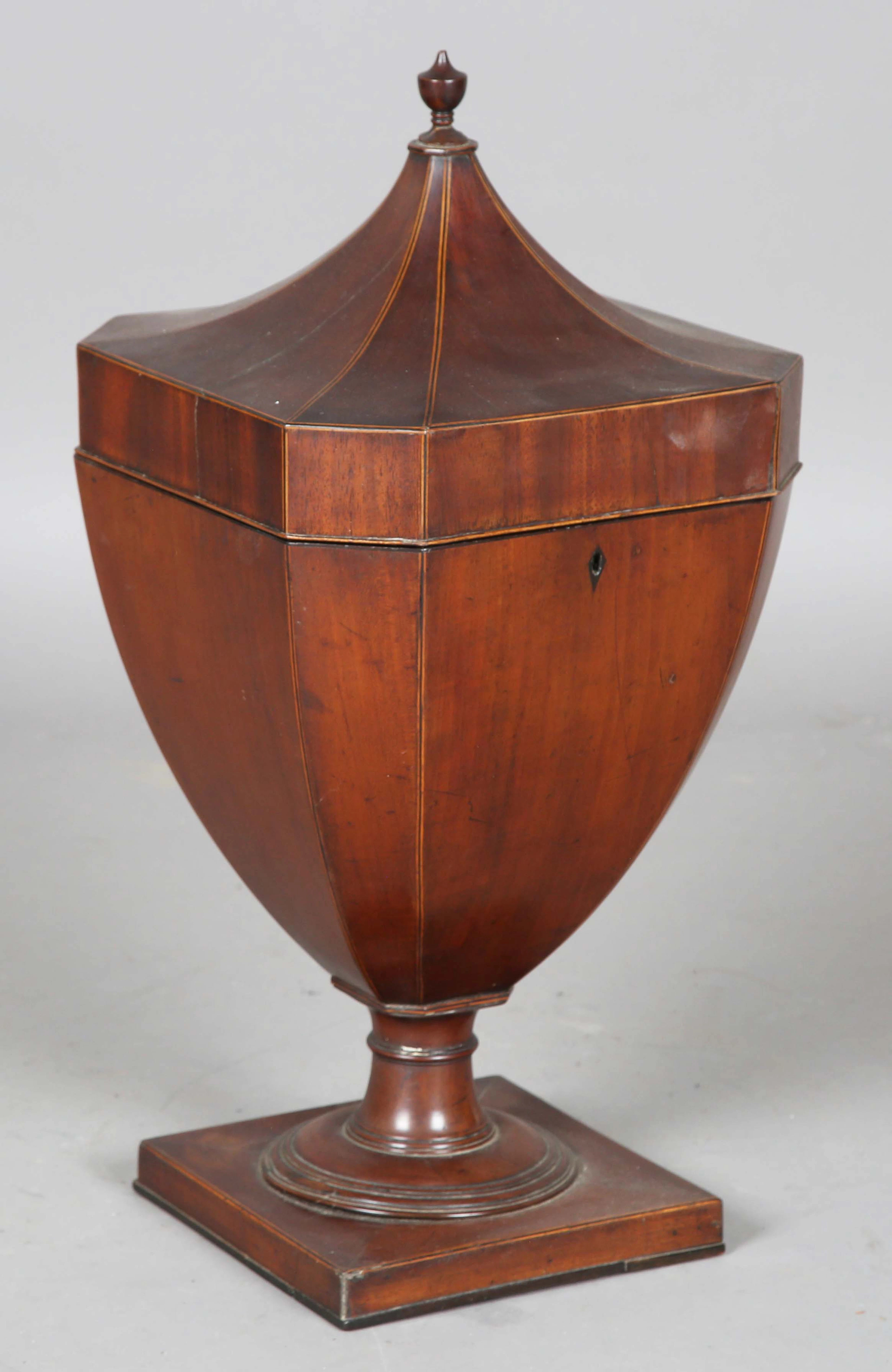 A late George III mahogany cutlery box of canted square section urn