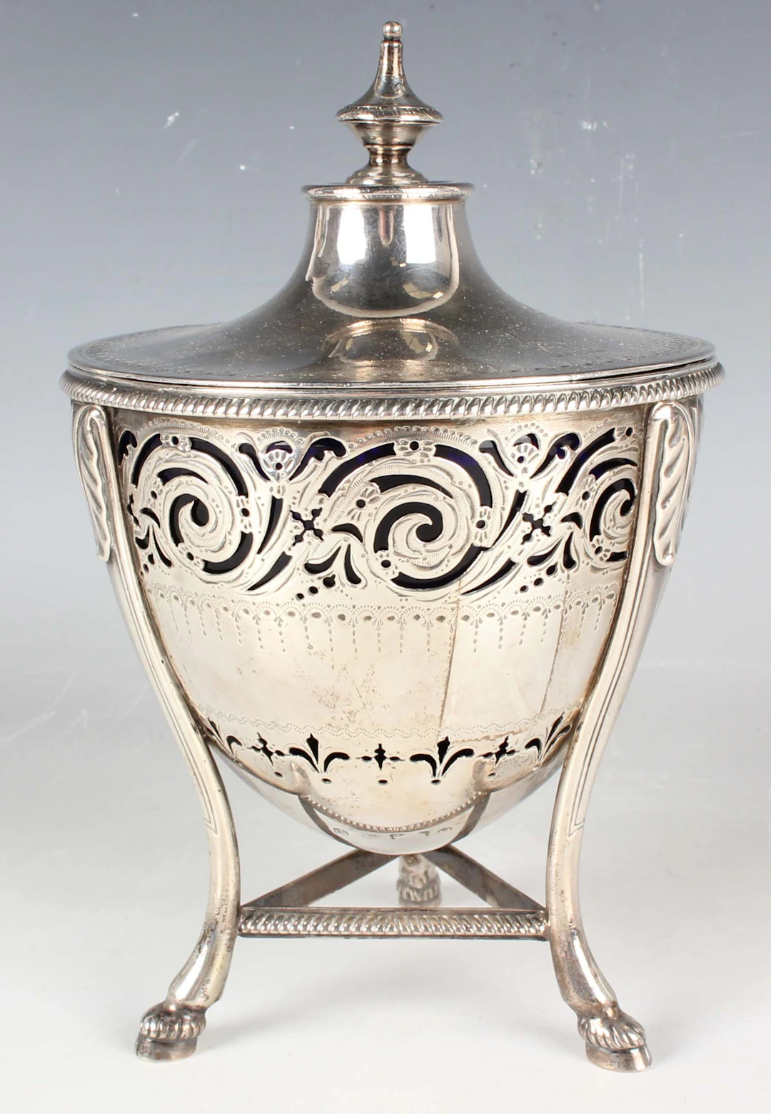 A George III silver sugar bowl and cover of tapered circular form
