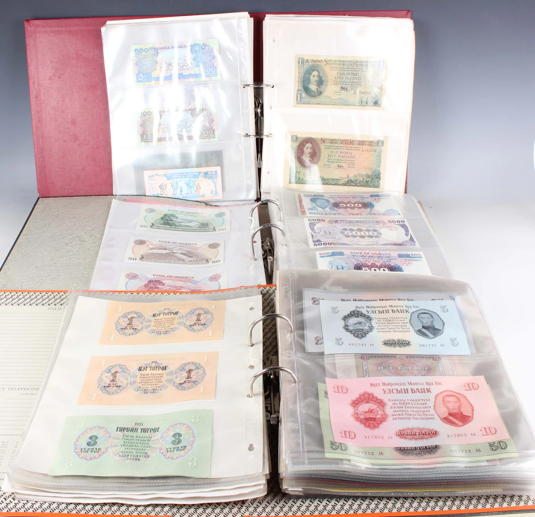 A large collection of European and world banknotes, including Mexico