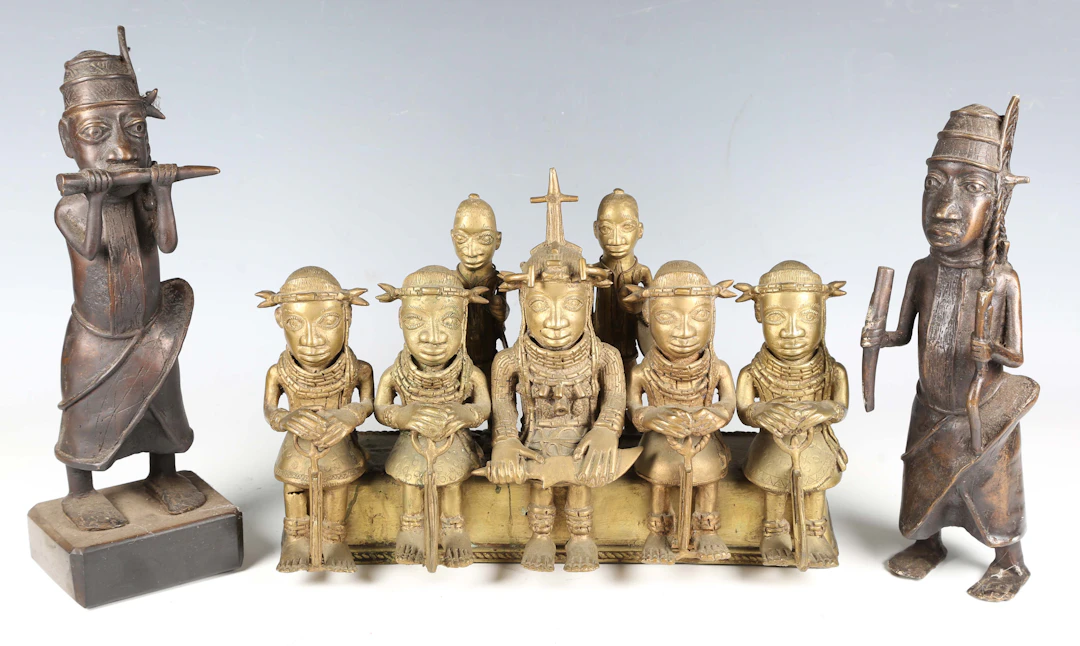 A Benin style cast brass figure group of five seated dignitaries and