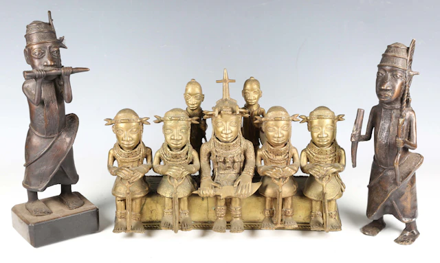 A Benin style cast brass figure group of five seated dignitaries and