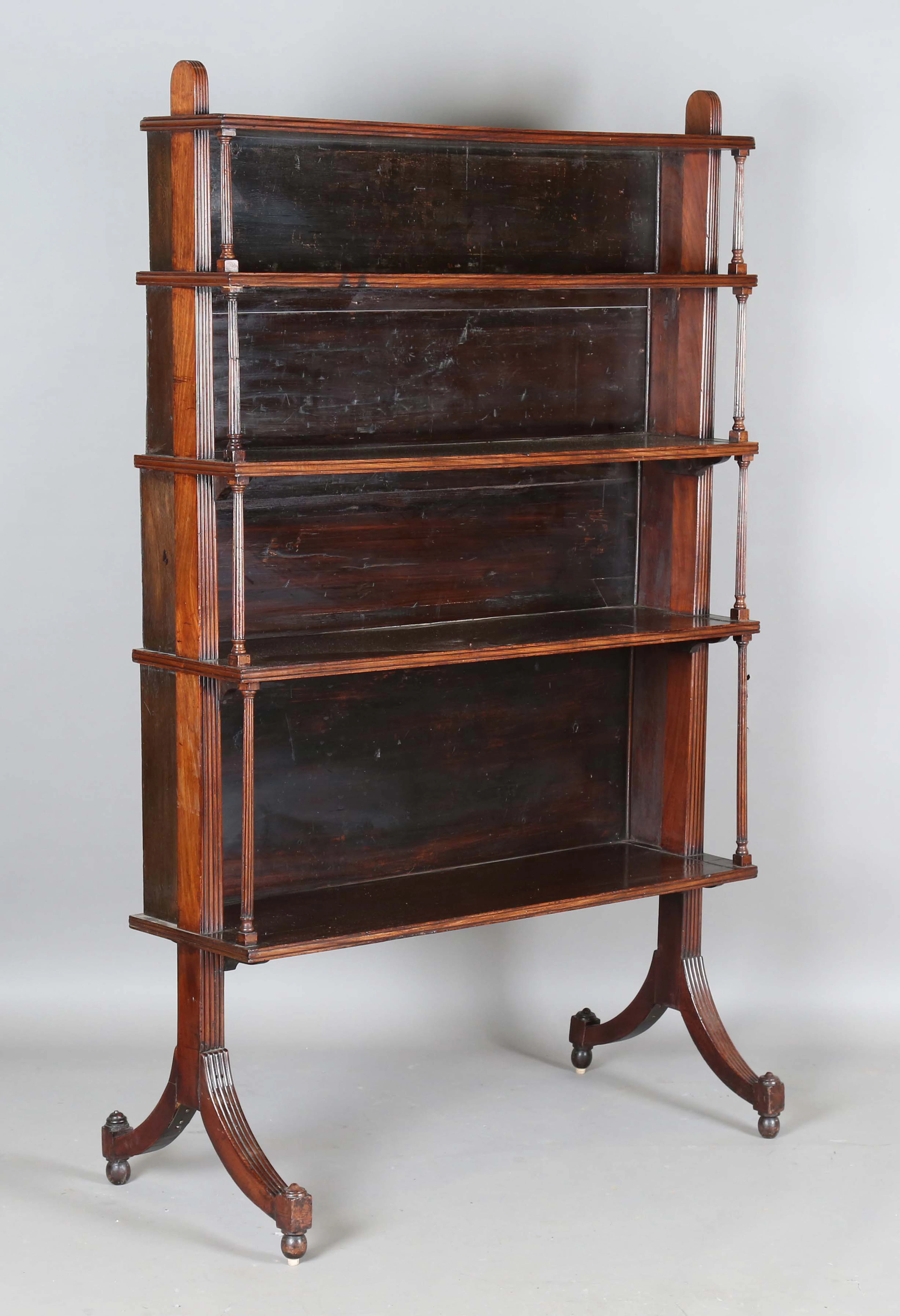 A 19th century mahogany four-tier open waterfall bookcase, probably