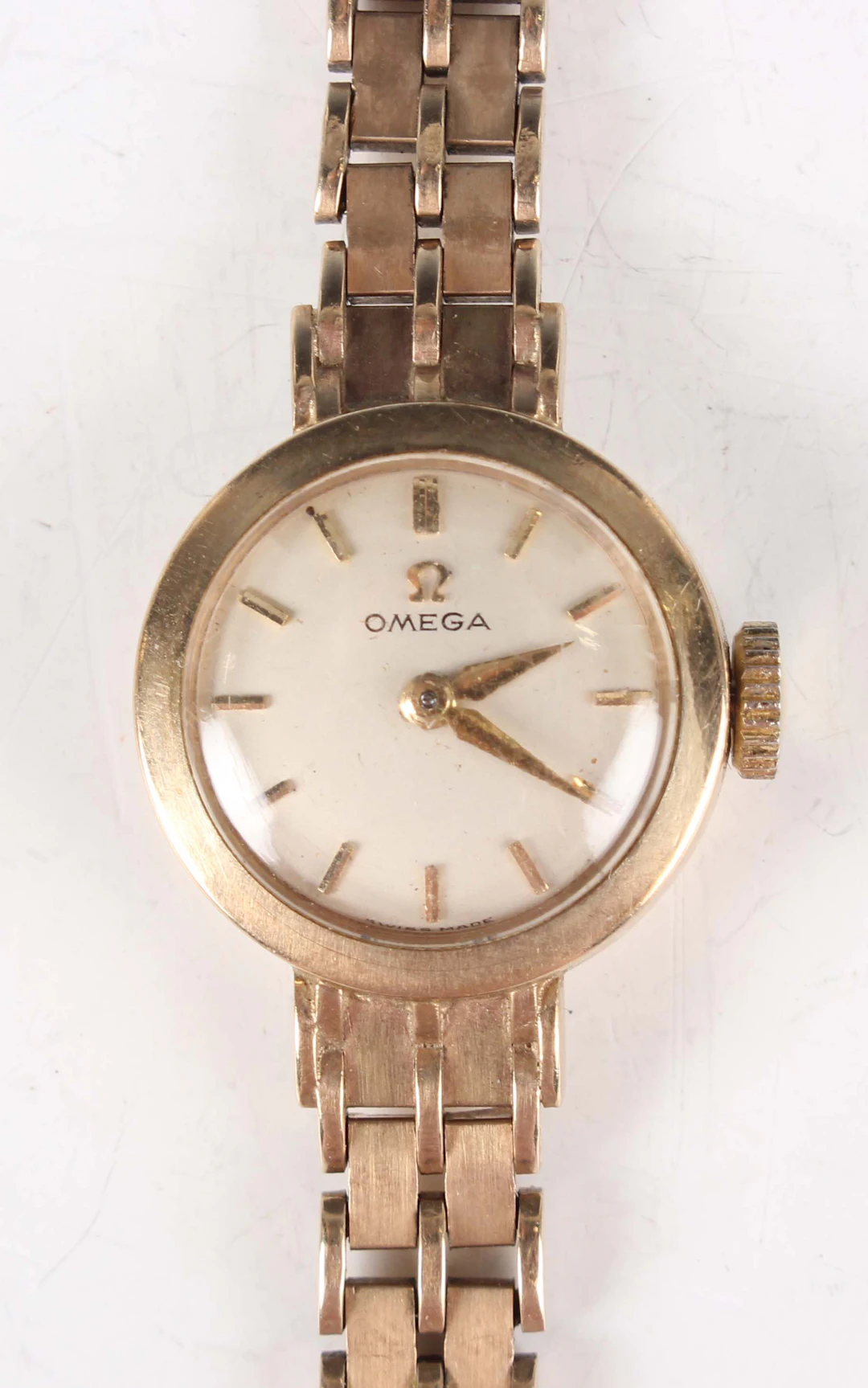 An Omega 9ct gold lady's bracelet wristwatch with signed and jewelled