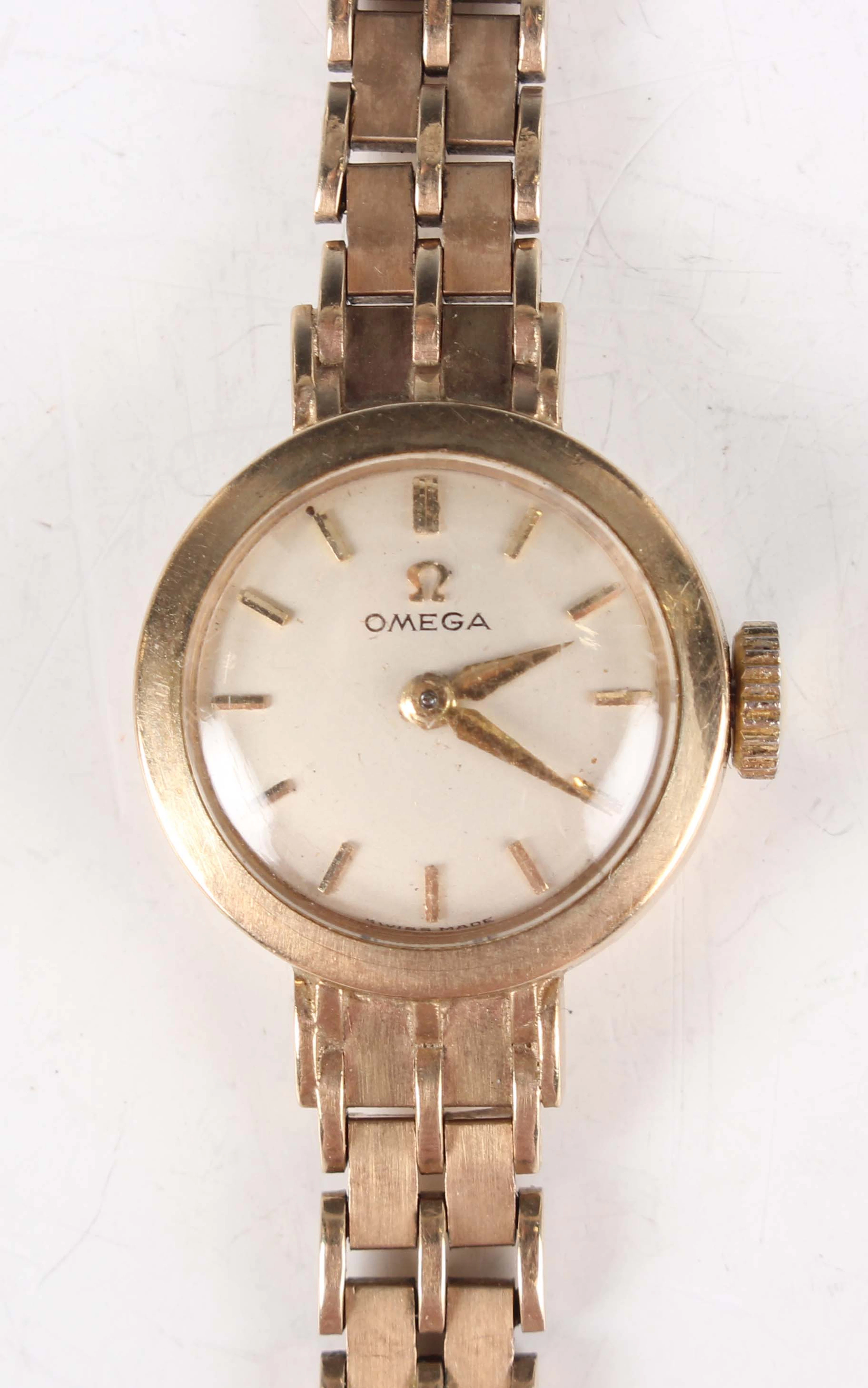 An Omega 9ct gold lady's bracelet wristwatch with signed and jewelled