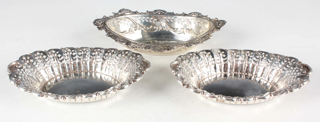 A pair of late Victorian silver oval bonbon dishes, each with pierced