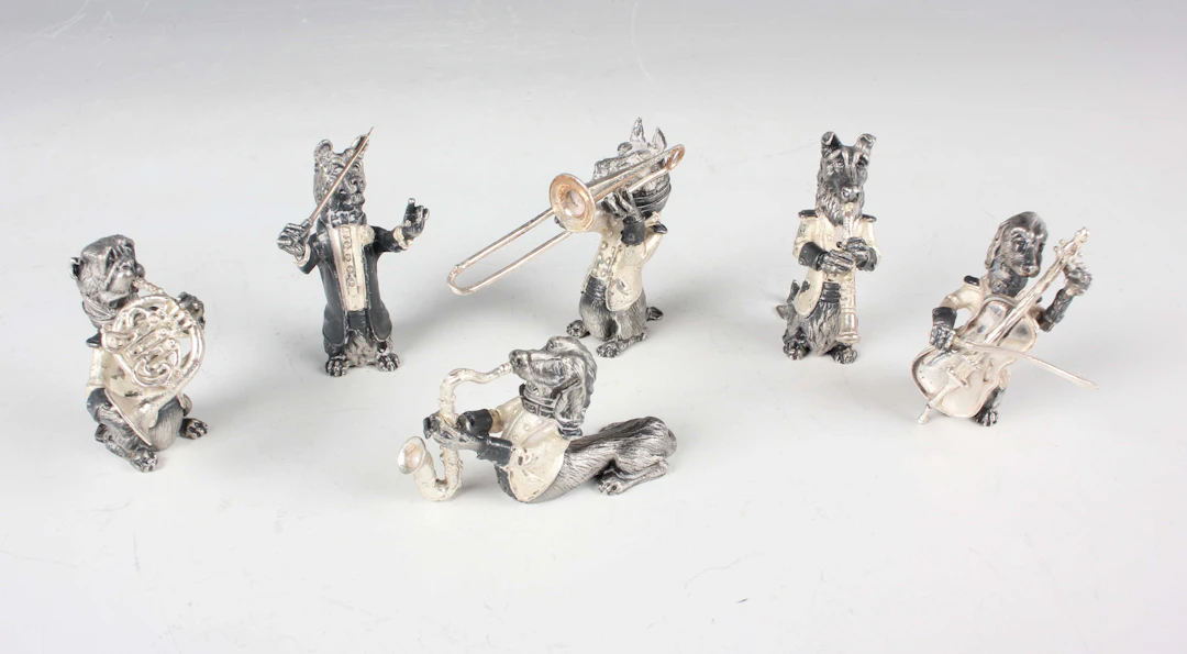 A set of six Spanish silver J.M. Calero style models of dogs playing