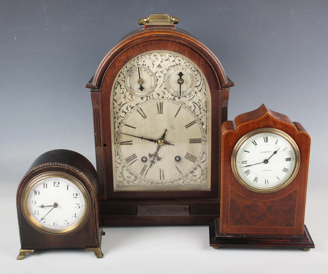 An early 20th century oak cased mantel clock with eight day movement