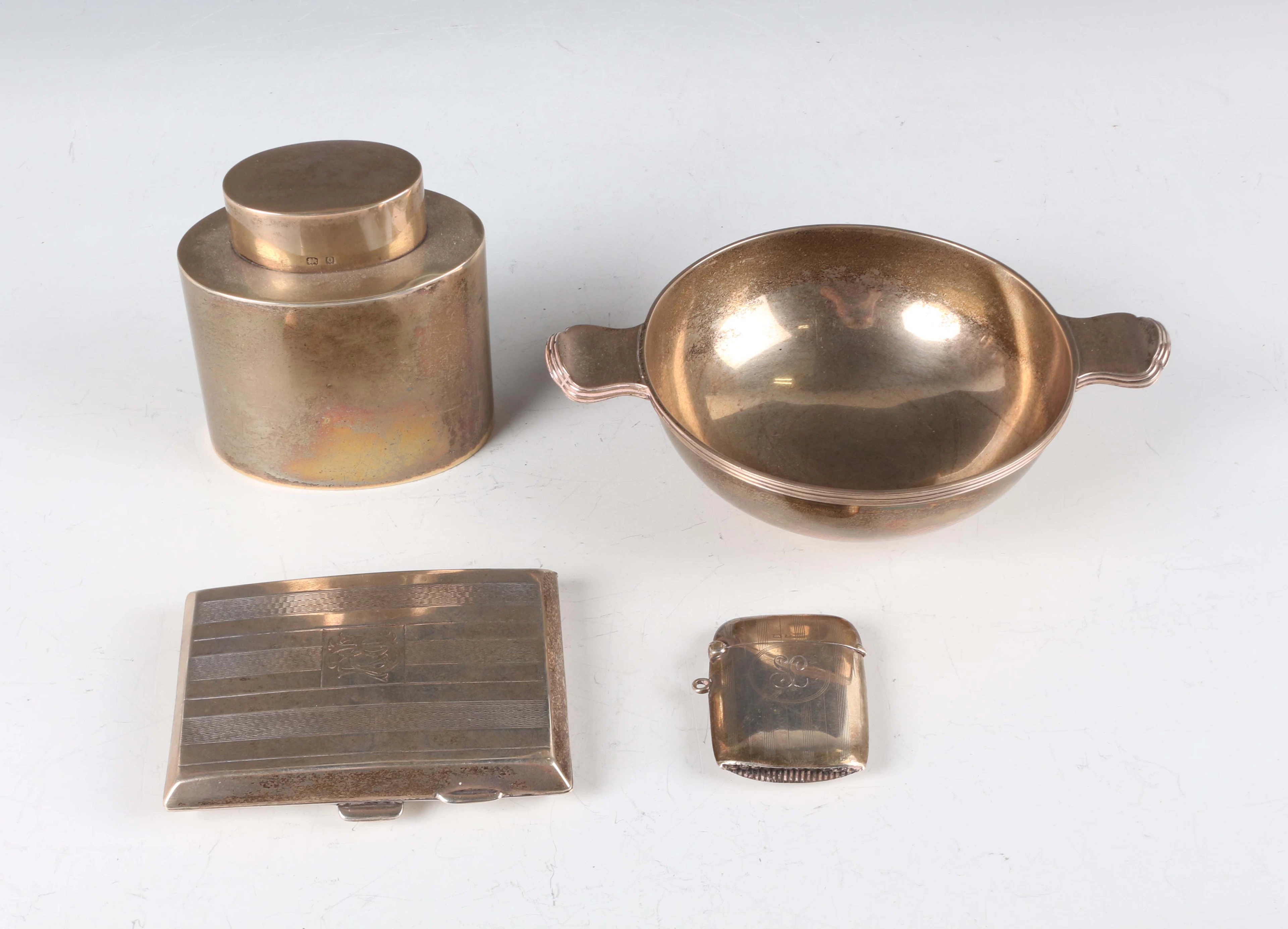 A George V silver cylindrical oval tea caddy and cover, Birmingham