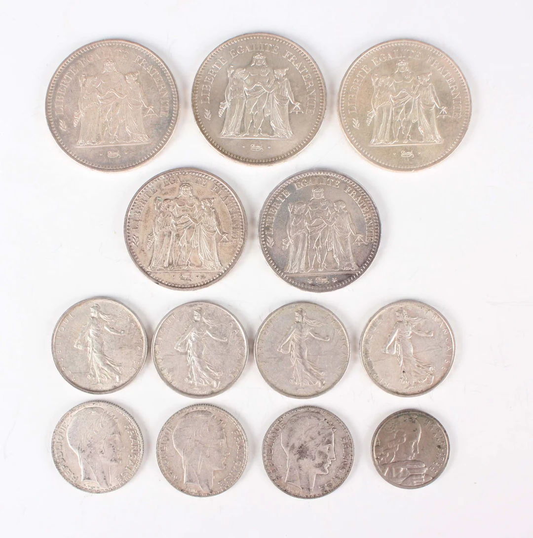 A small collection of French silver and other coinage, including three