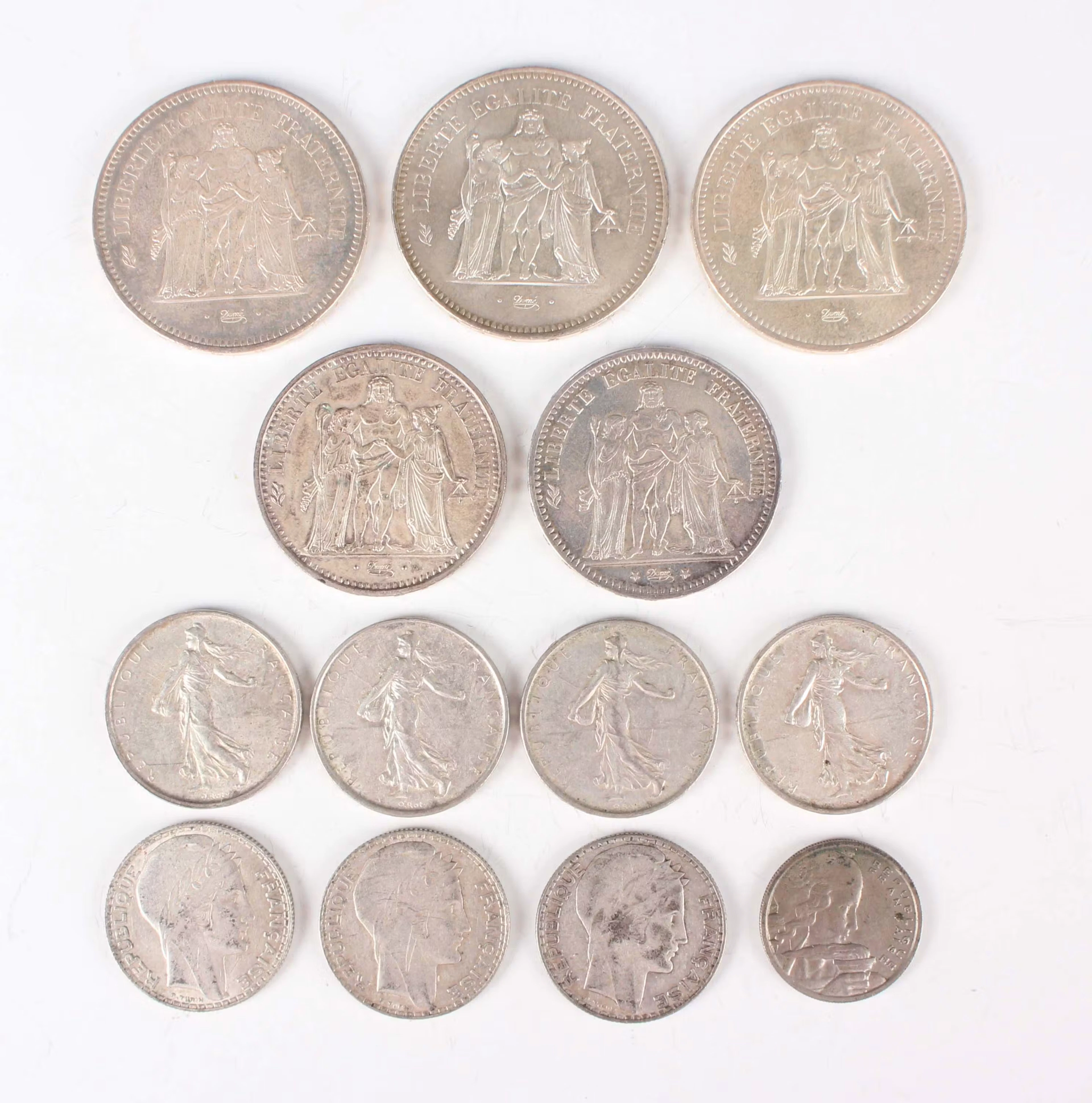 A small collection of French silver and other coinage, including three