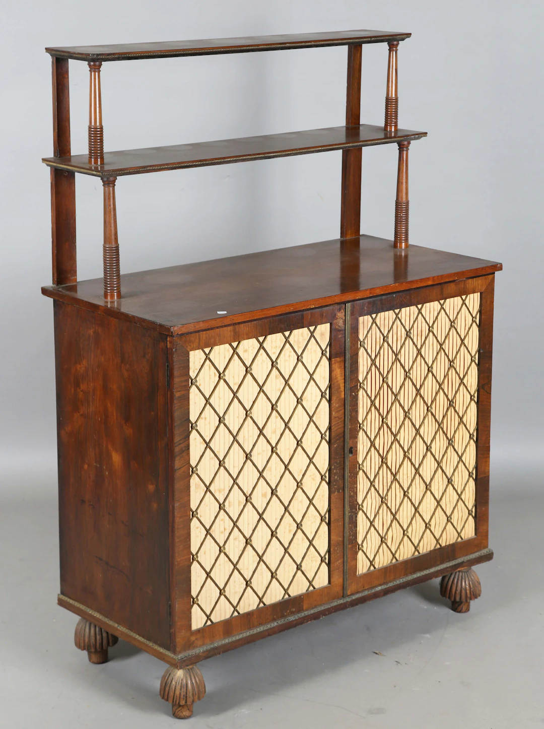 A Regency rosewood chiffonier, fitted with two graduated shelves and