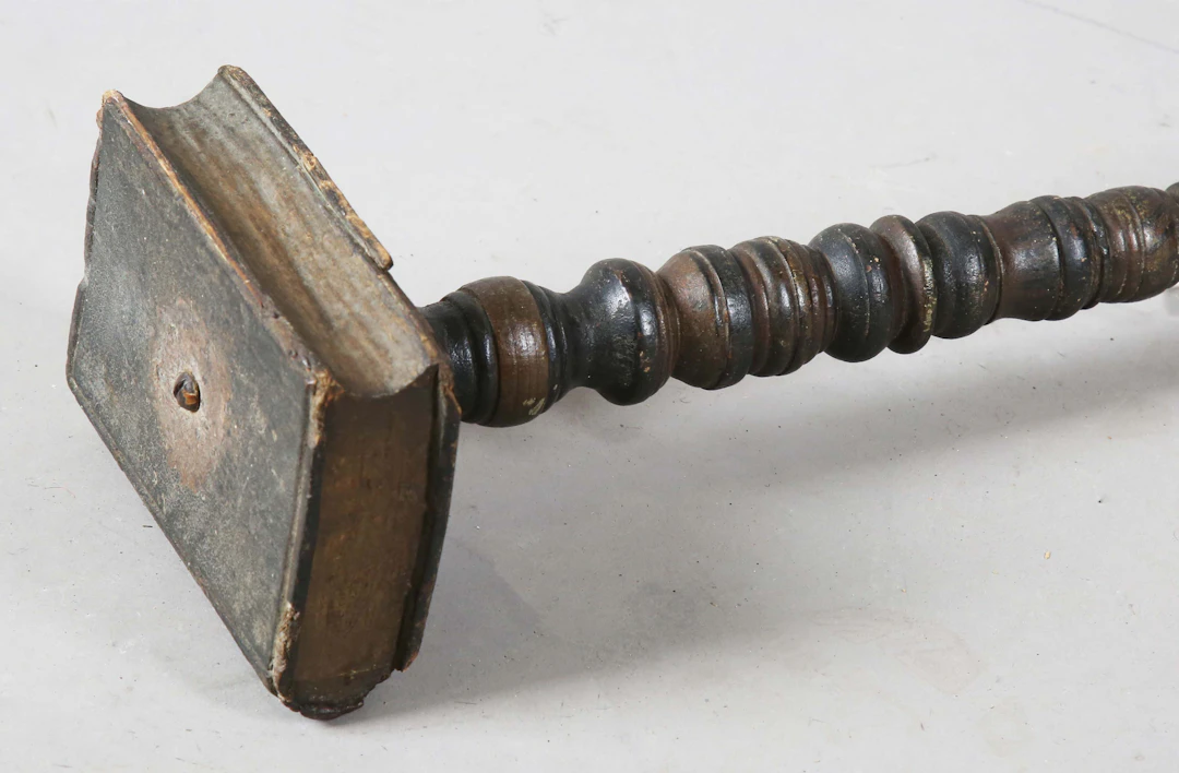 A 19th century American painted wooden preacher's stick with a carved